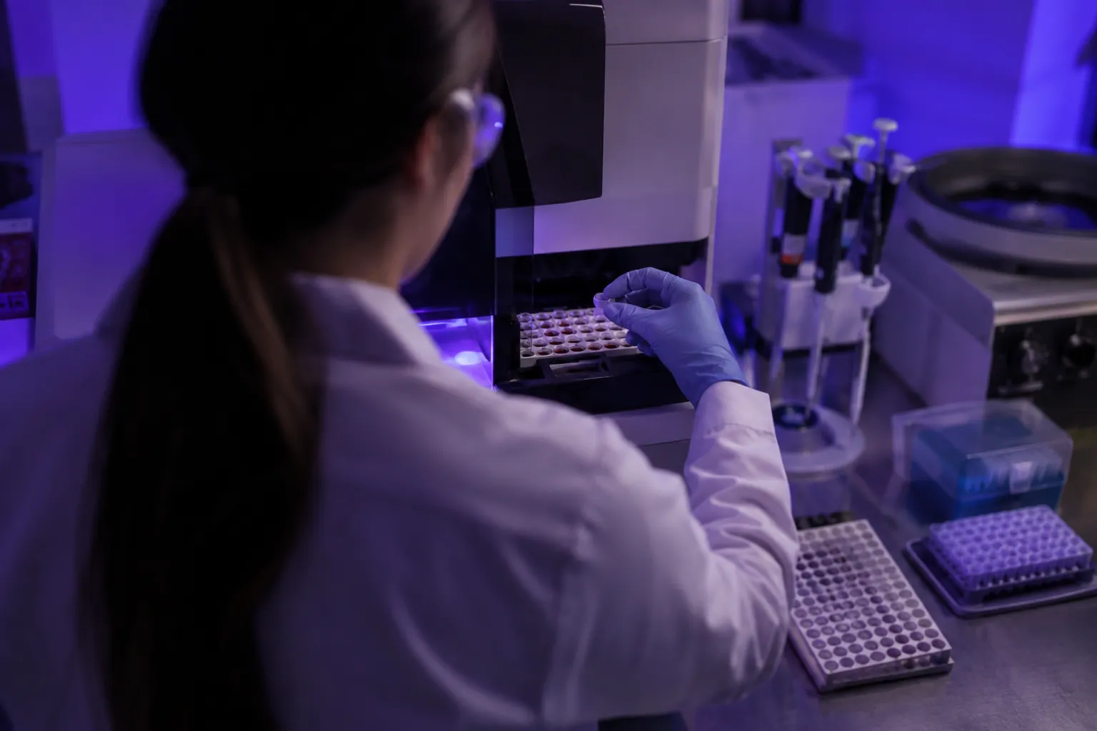 Laboratory technician processing dried blood spot samples