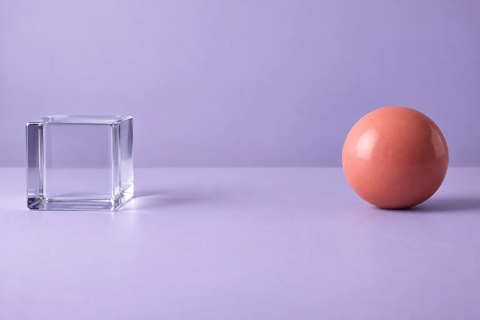 Abstract separated glass cube and coral sphere, not a biological diagram, test result or clinical evidence