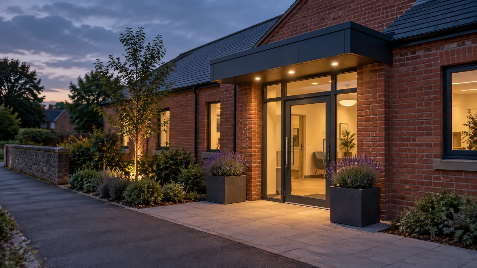 Illustrative red-brick community building entrance at dusk, not an identifiable clinic or mescreen™ premises