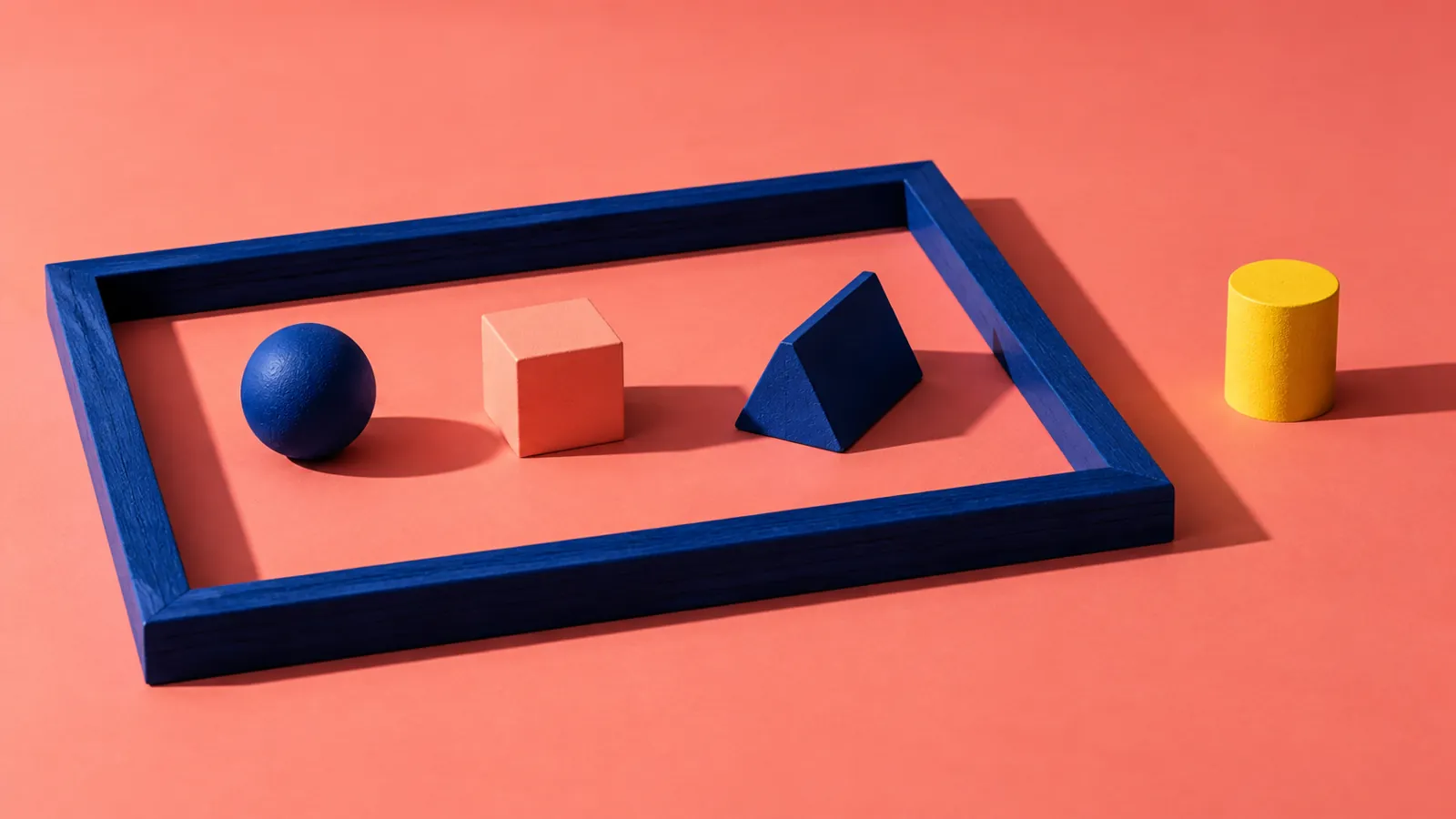 Conceptual coloured shapes inside and outside a frame representing a defined scope