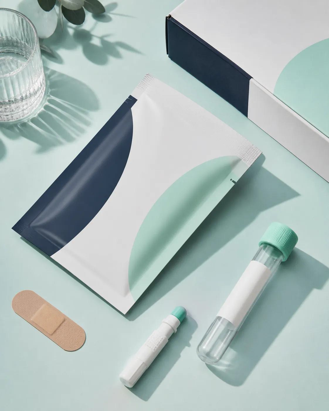 Sealed UK home finger-prick kit arranged as a calm clinical flat lay